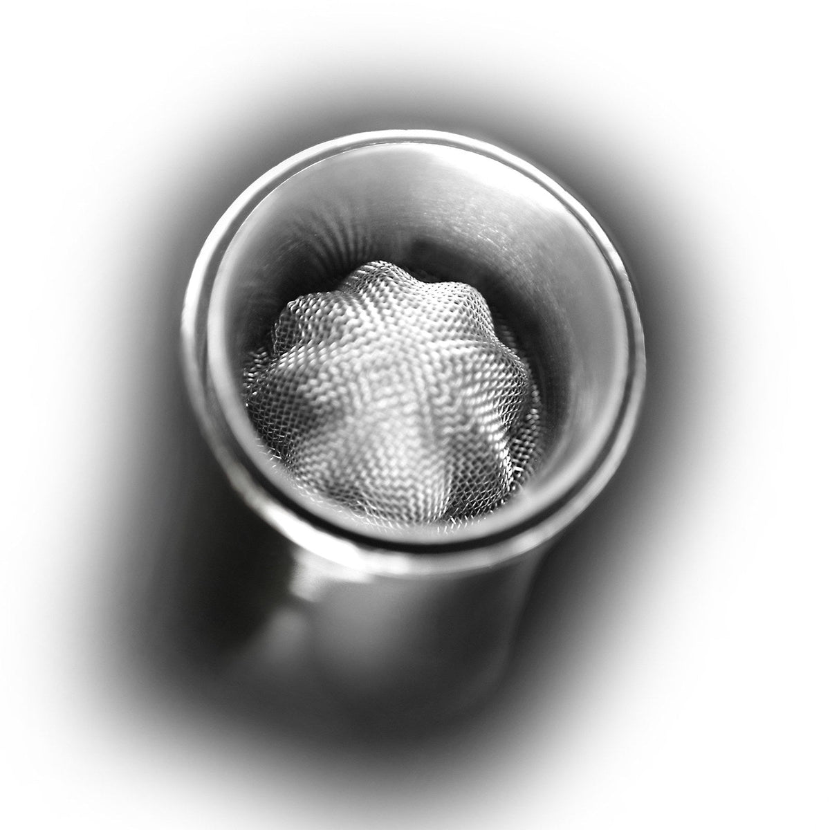 Close-up of the fine steel mesh filter inside the VAGNBYS 7-in-1 wine decanter