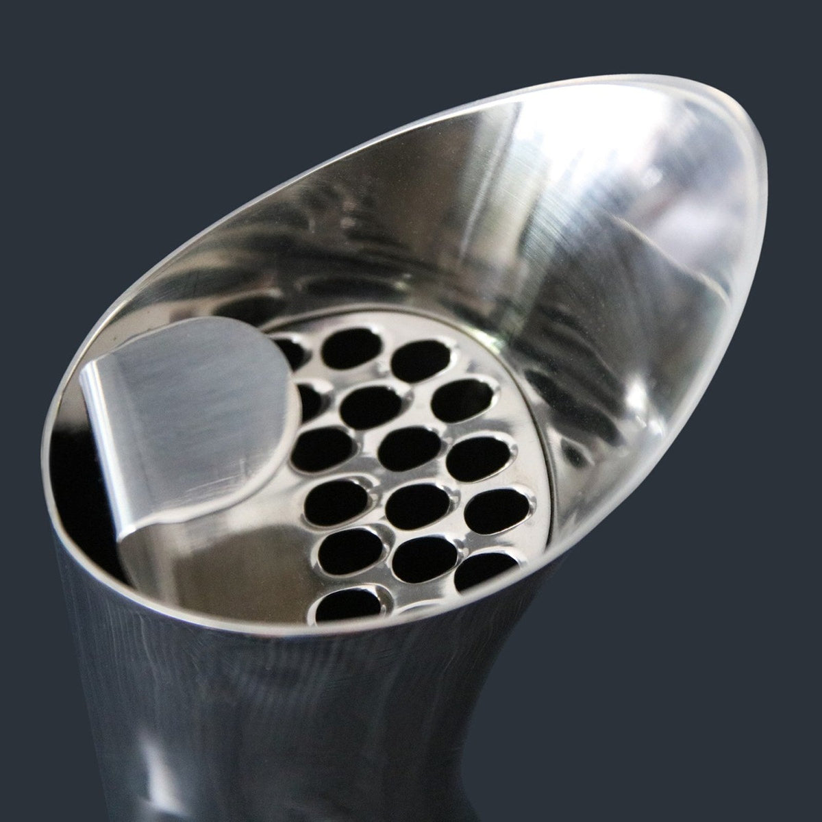 The ice cube separator (ice catcher) seated in the spout of the VAGNBYS Swan Carafe